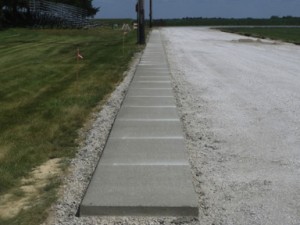 The newly-poured concrete sidewalk is the most recent work done at the... 			
			</div>
				<a href=