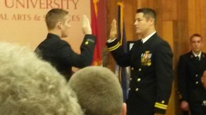 LT Cole Weideman (on the right) administers the Oath of Office to ENS... 			
			</div>
				<a href=