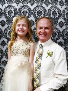 Olivia Norrish and her father, Rick, pose for a picture. Each attendee received a 4x6 photo.