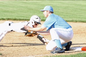Senior Lucas Smith stops the ball in his glove but comes up short of the tag in the battle against West Marshall on Tuesday, June 16.