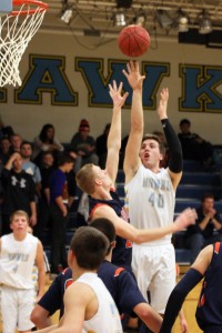 Senior Kyle Van Dyke gets a jumper up over the outstretched arms of his Tigerhawk defender