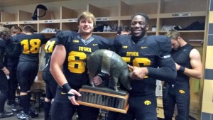 Terlouw and teammate Faith Ekakitie hold up the Floyd of Rosedale trophy the Hawkeyes took home after beating Minnesota.
