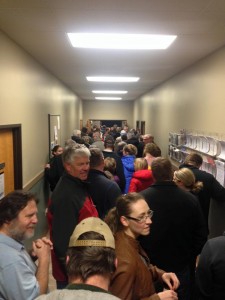 A long line of caucus goers waits patiently to get into the standing-room-only Republican caucus held at the Sully Community Center on Monday, Feb. 1. 