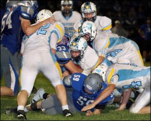 Dylan Roozeboom, #50, makes a tackle in his last football game as an L-S Hawk. The senior is a leader on and off the field and is Lynnville-Sully’s school winner of the Wendy’s High School Heisman award.