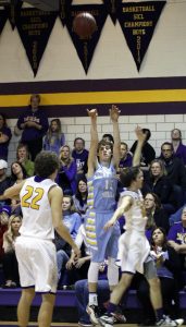 Junior Tanner Foster puts up a three on the road at Keota on Friday. He finished with five points.