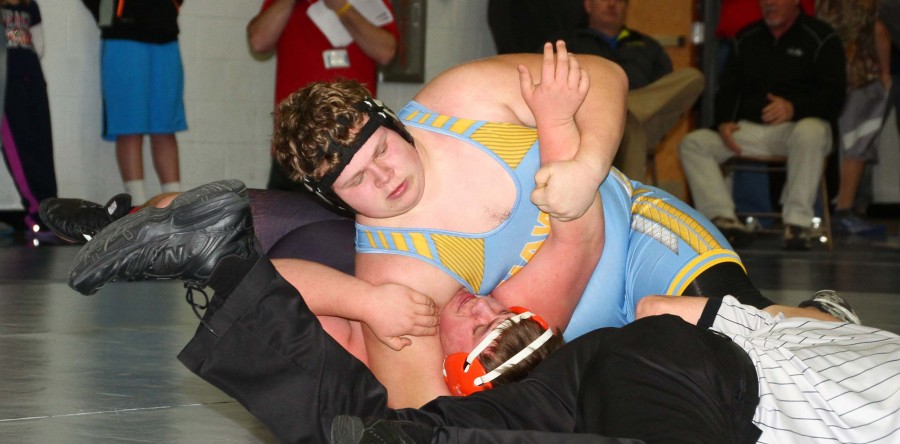 Hawk grapplers secure regional ticket by one point, send five to districts