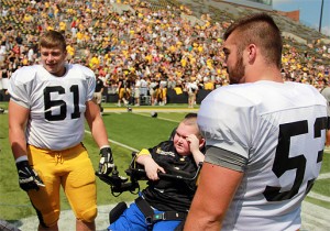 Hawkeye football players connect with Kid Captains at Aug. 15 practice