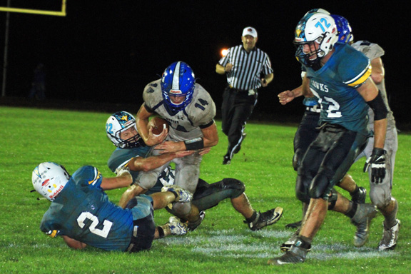 Hawks upset No. 7-ranked Braves in soggy battle