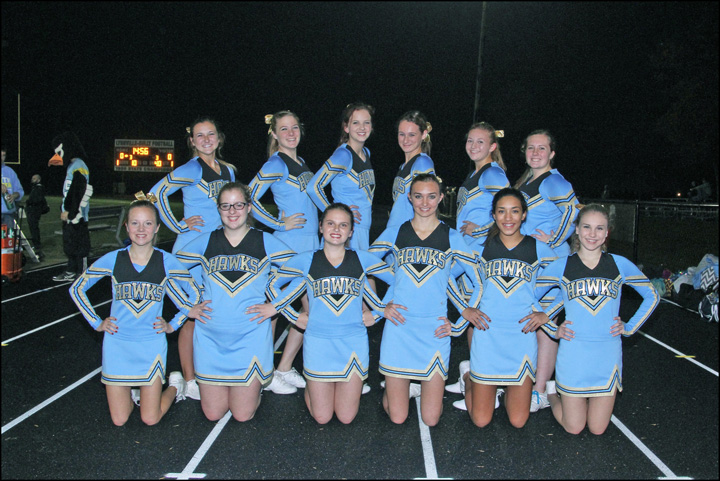 Thirteen girls on cheerleading squad help Hawk spirit soar