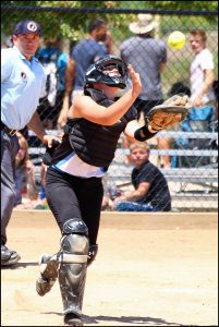 Senior catcher Kristen Van Der Wilt lines her glove up under a popped-up ball at the Saturday tournament.