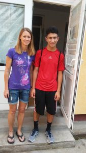 Julie and Luke walk out the door of the orphanage that Julie carried 12-month-old Luke out of on Dec. 5, 1999.