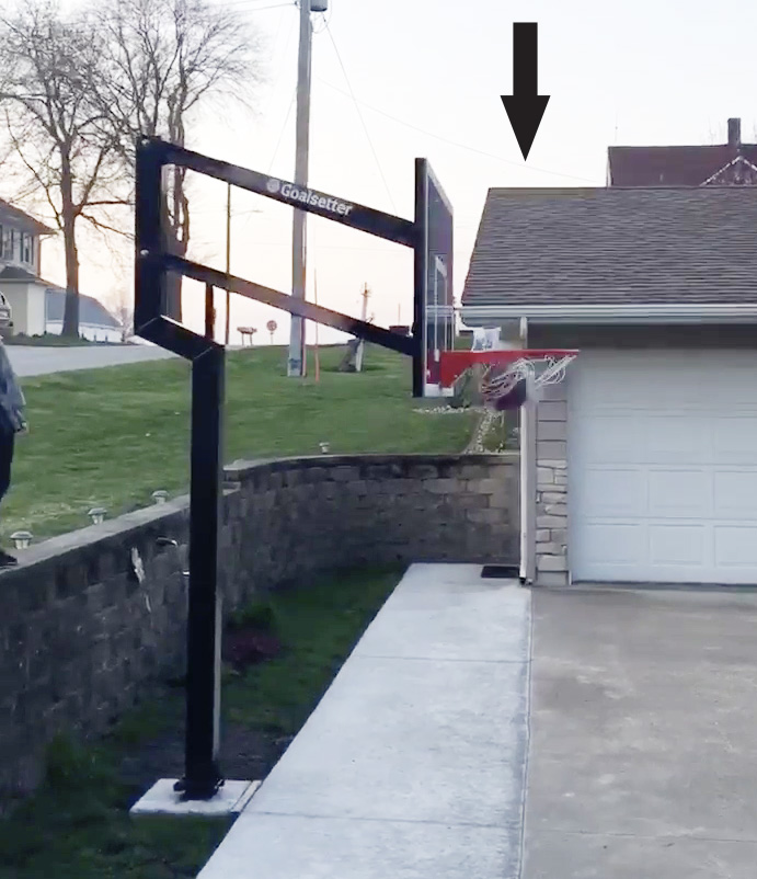 L-S boys basketball coach hits trick shot from behind garage