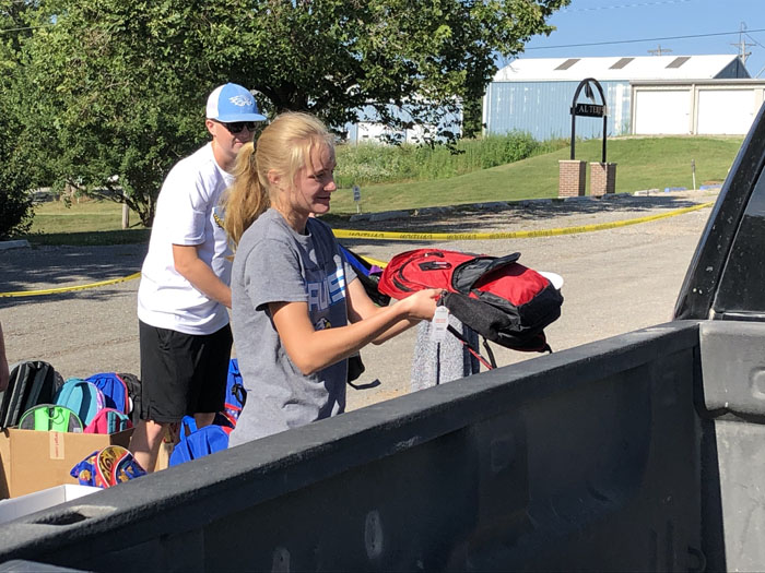 Heart of Worship gives away over 100 backpacks and school supplies