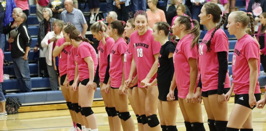 Hawk volleyball claims first in pool play at NM, fights errors on Pink Out night