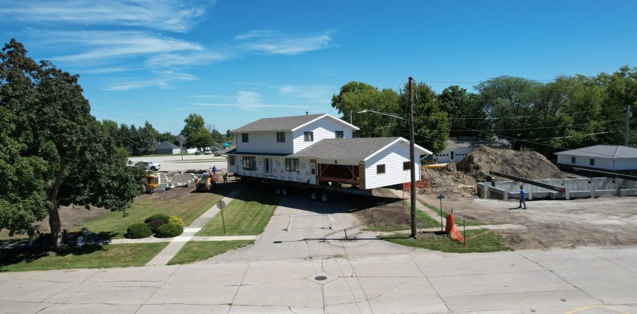Sully Christian Reformed Church’s parsonage makes the short trek to a new foundation